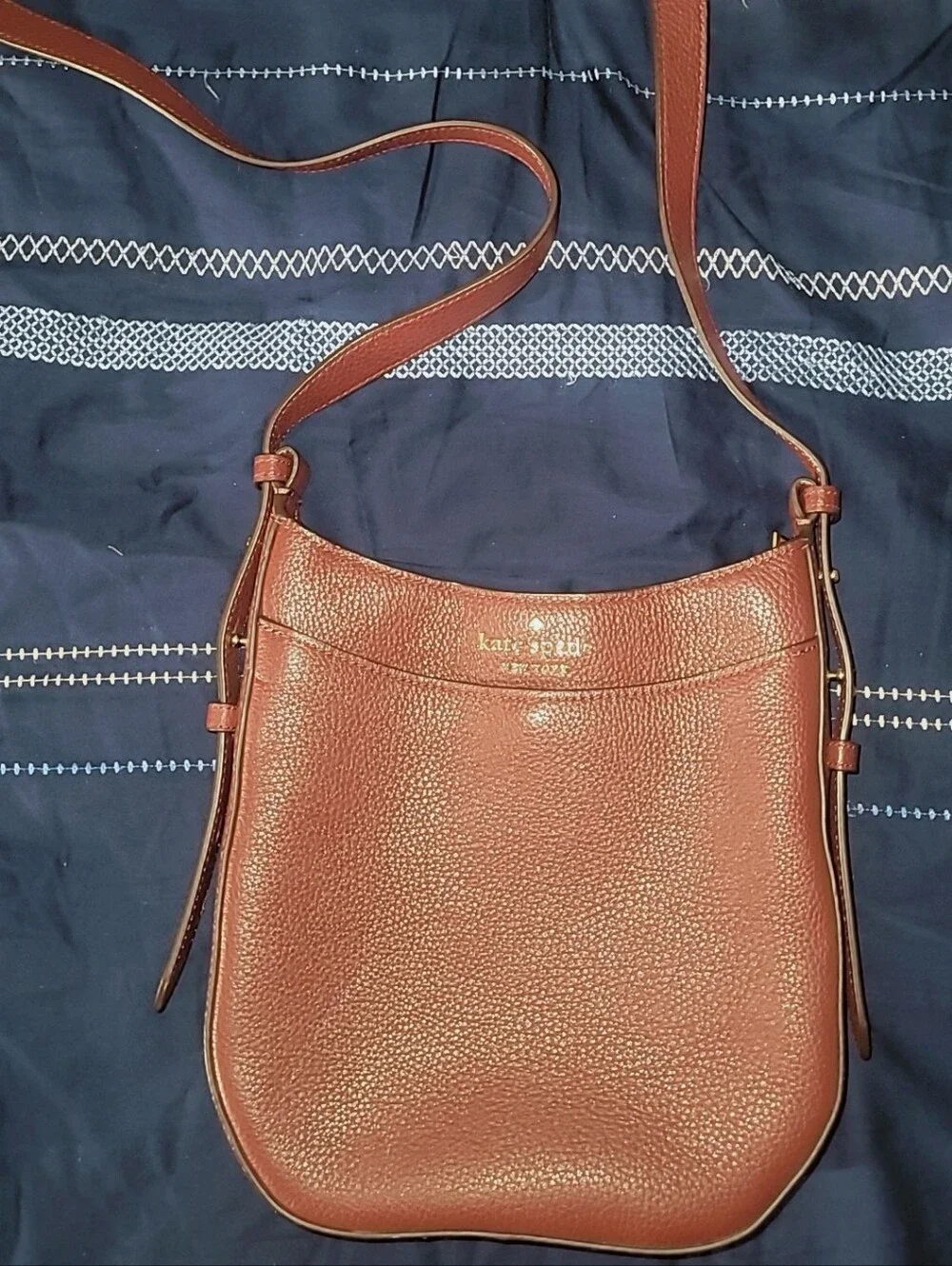 kate spade Burgundy pebbled leather crossbody bag with gold logo